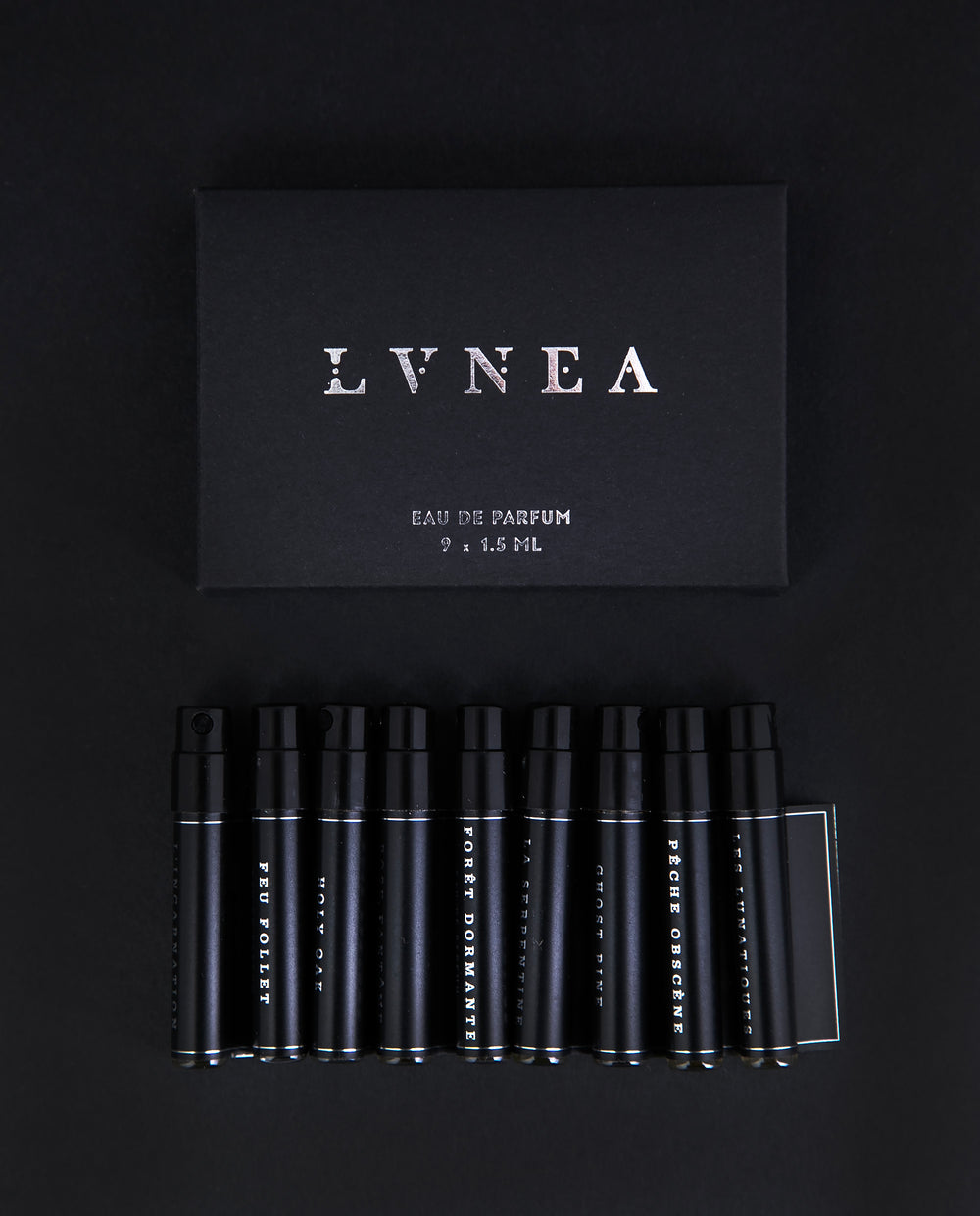 Black cardboard box containing all 9 LVNEA Eau de Parfum sample vials