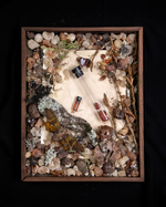 "Amber" diorama; an overhead still life of resins, fragrance vials, and elements reminiscent of the "amber" fragrance family.