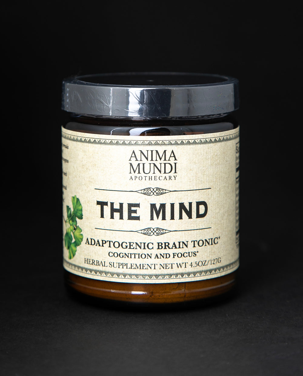 Amber glass jar with black lid of Anima Mundi's 