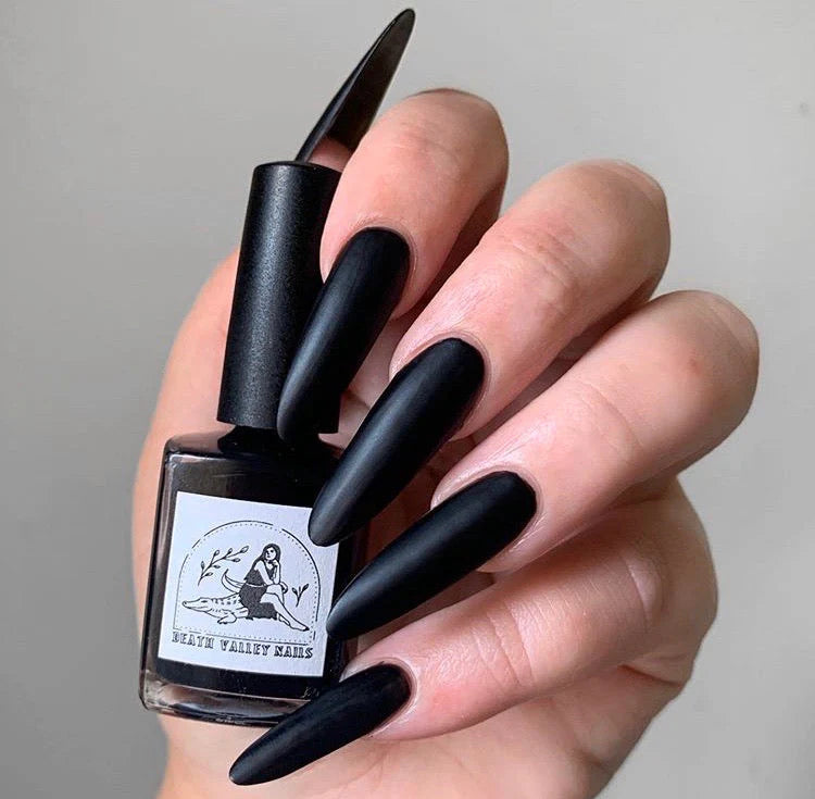 
                      
                        "Badwater" nailpolish shown on model, it has a black matte finish
                      
                    