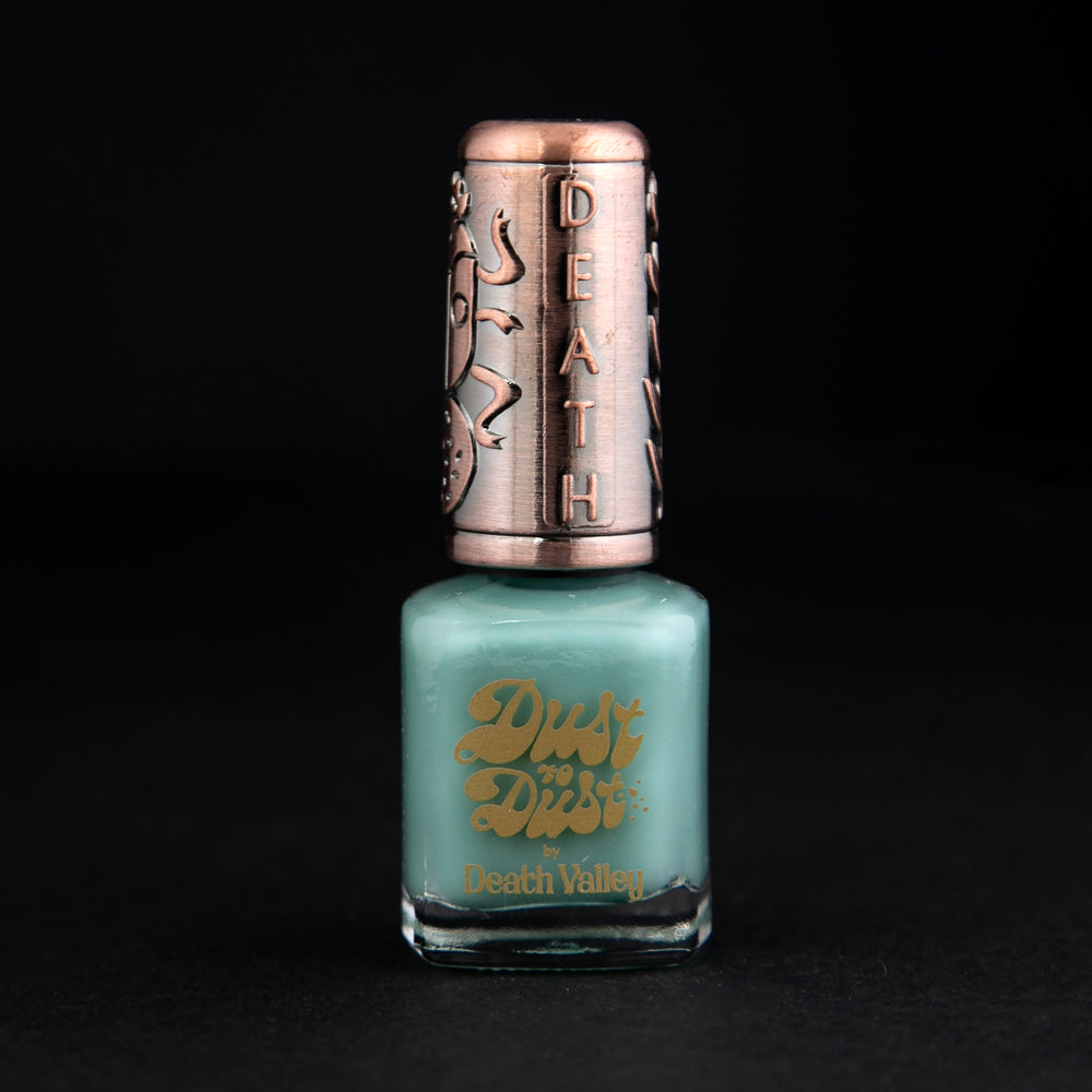 "Chrysocolla" nail polish by Death Valley Nails against black background. The polish is a teal colour.