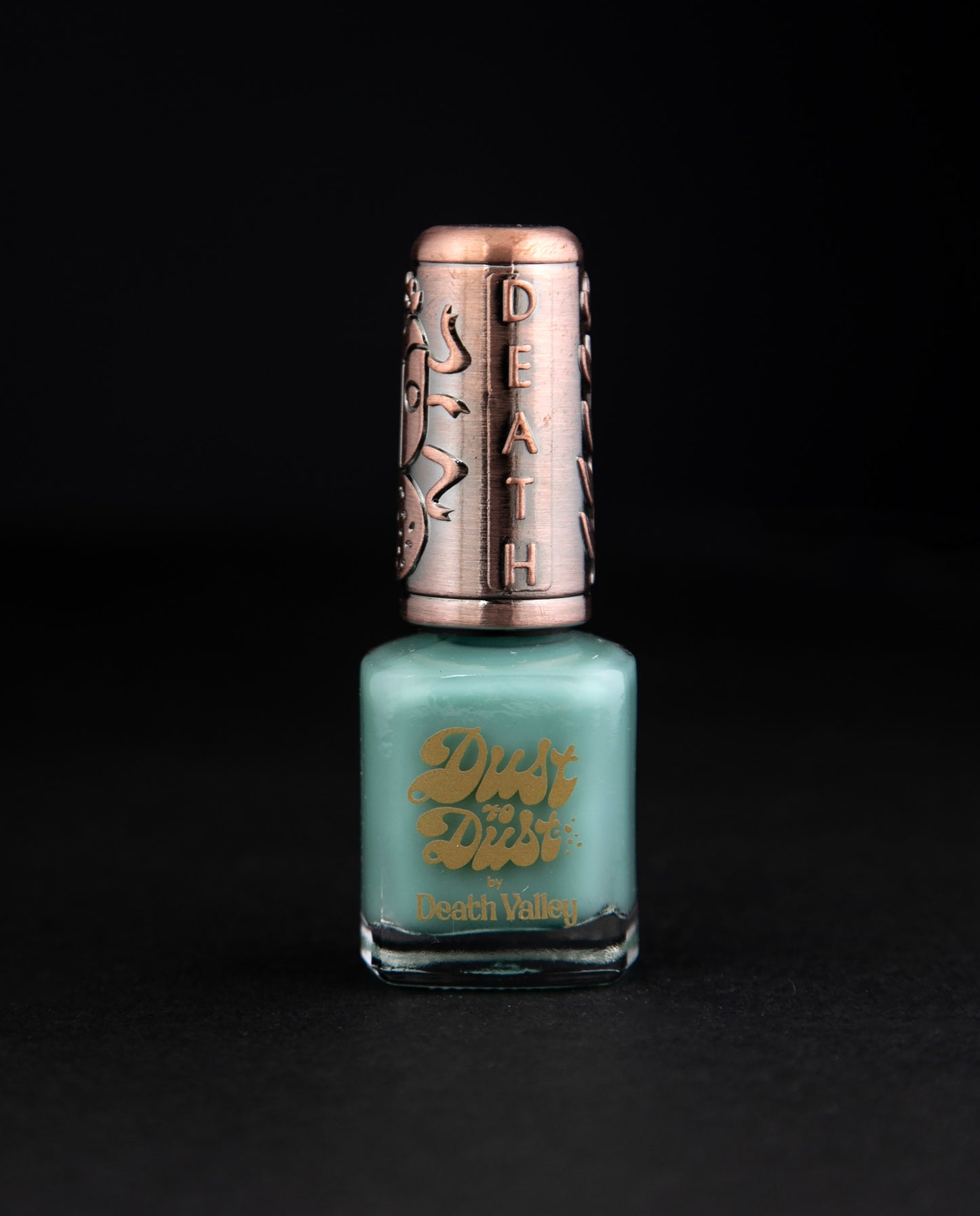 "Chrysocolla" nail polish by Death Valley Nails against black background. The polish is a teal colour.