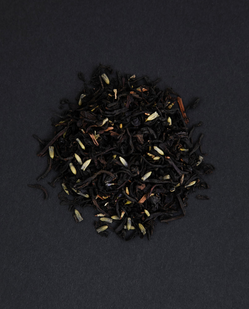 small pile of "earl grey provence" tea viewed from above against a black background