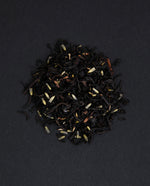 small pile of "earl grey provence" tea viewed from above against a black background