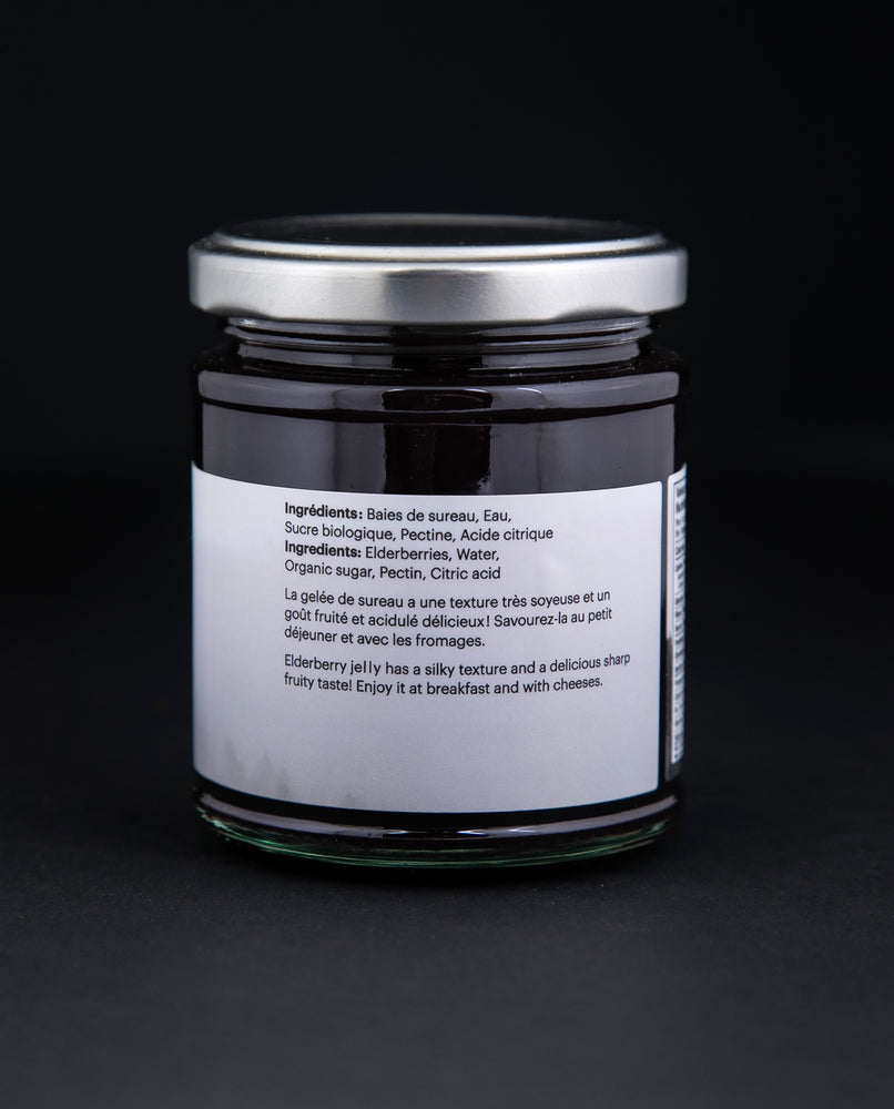 back label of a jar of elderberry jelly against a black background