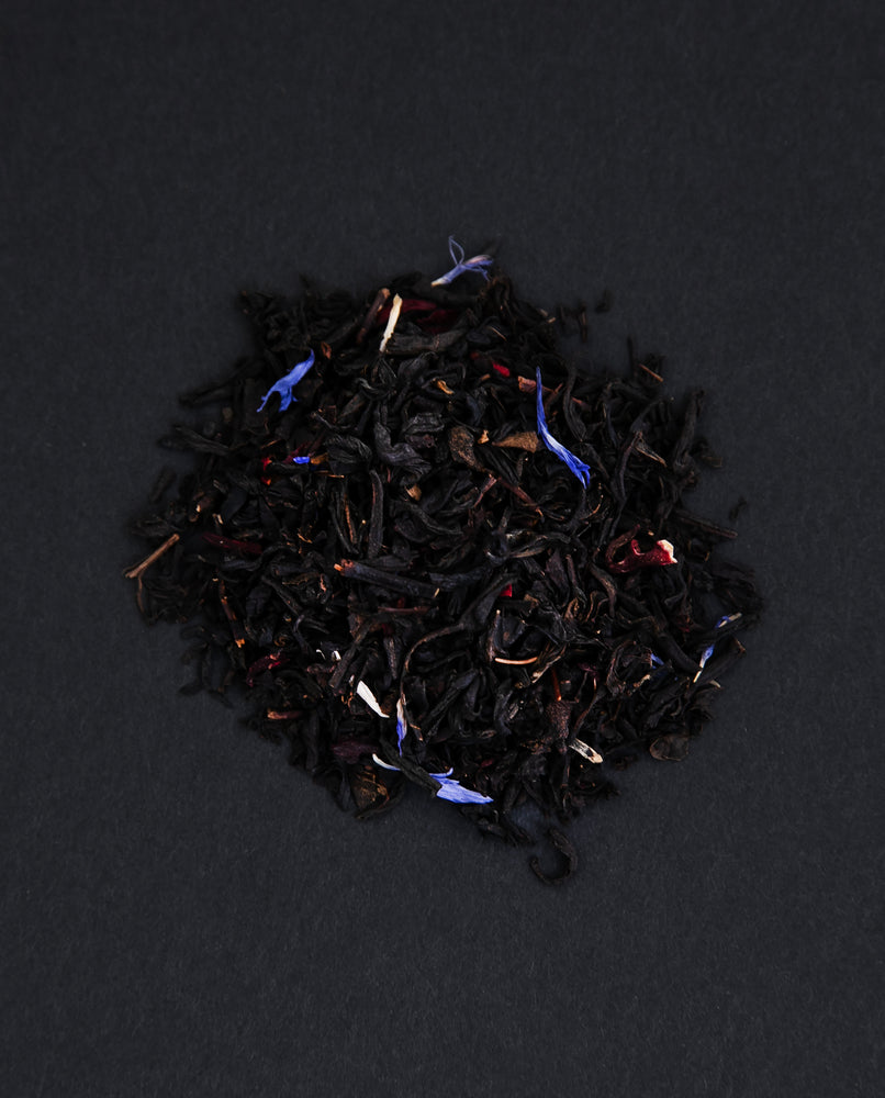 small pile of "eros" tea viewed from above against a black background