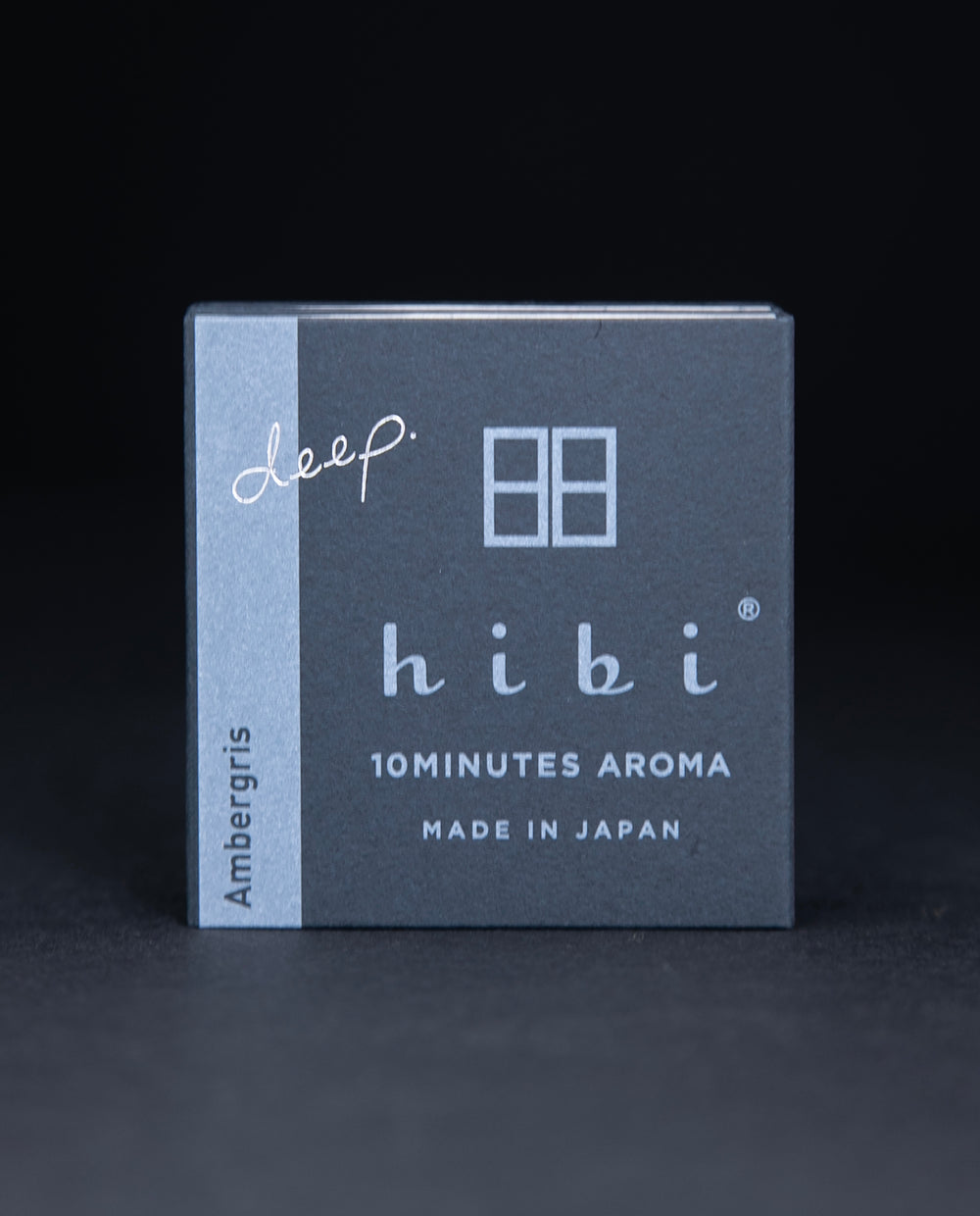 dark slate grey paper box containing HIBI 