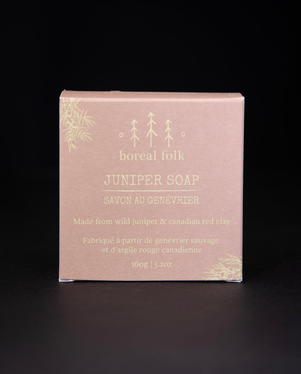 Earthy pink cardboard box of Boreal Folk's juniper soap against a black background