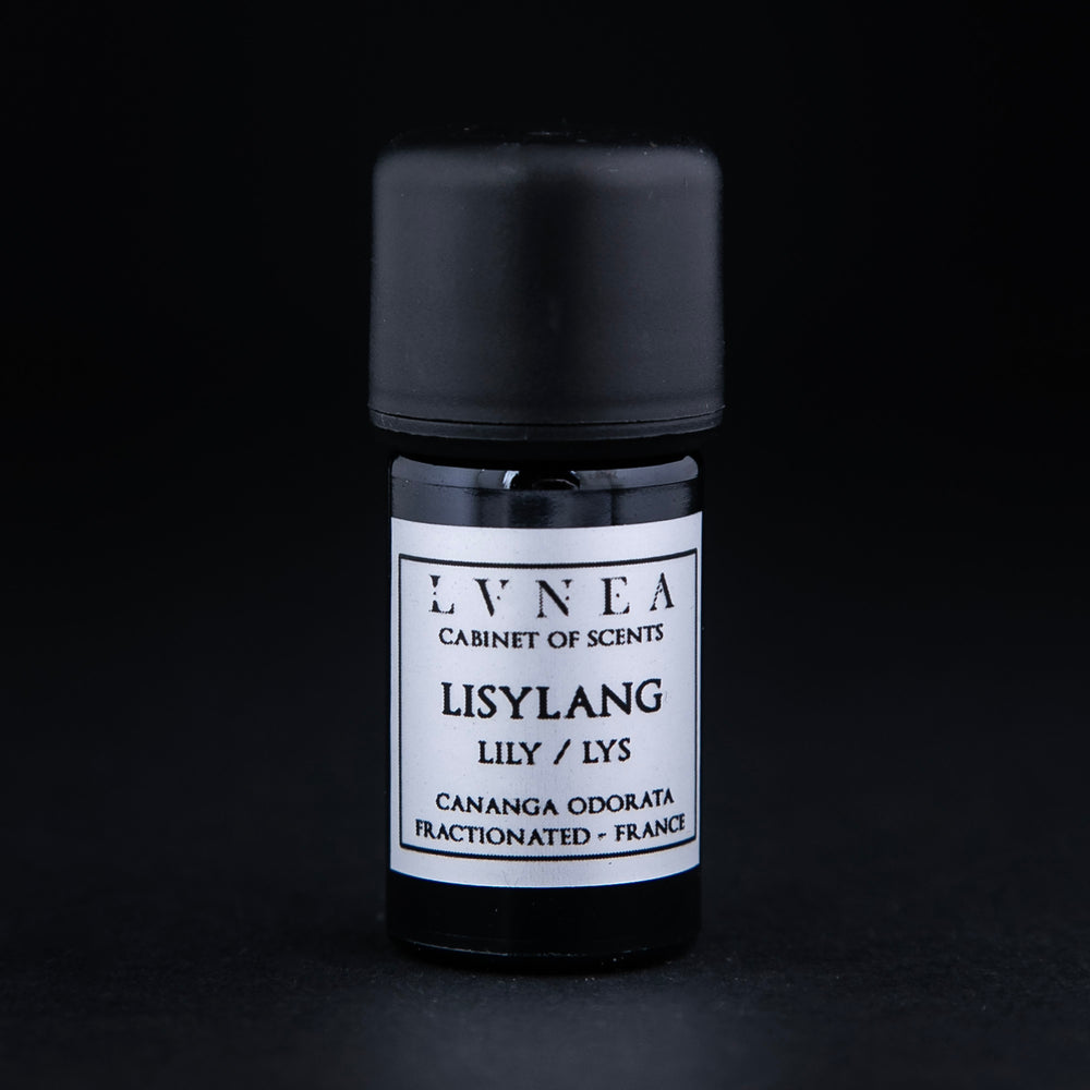 5ml black glass bottle of Lisylang essential oil on black background