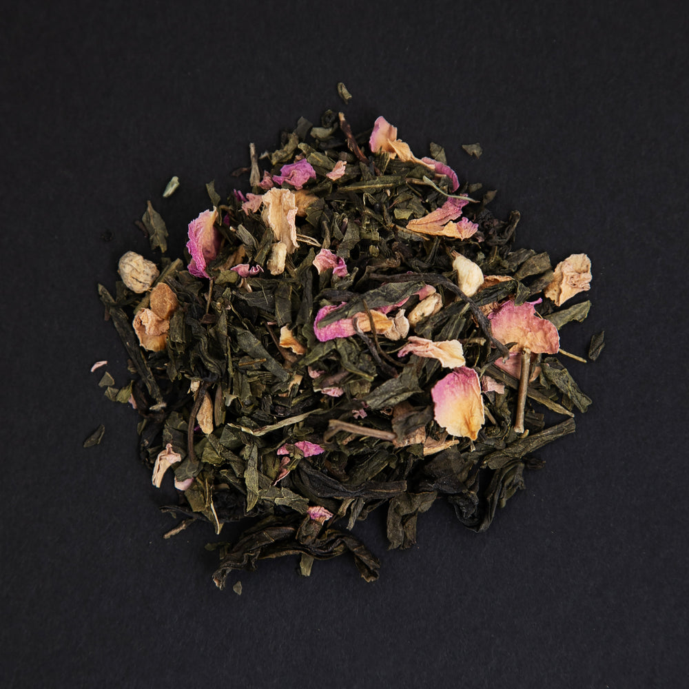 small pile of "lune rouge" tea viewed from above against a black background