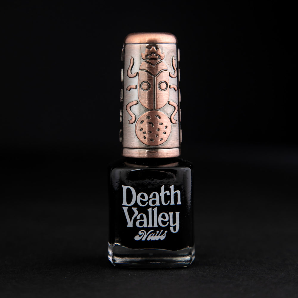 
                      
                        "Badwater" nail polish on black background. The polish is a matte black colour.
                      
                    