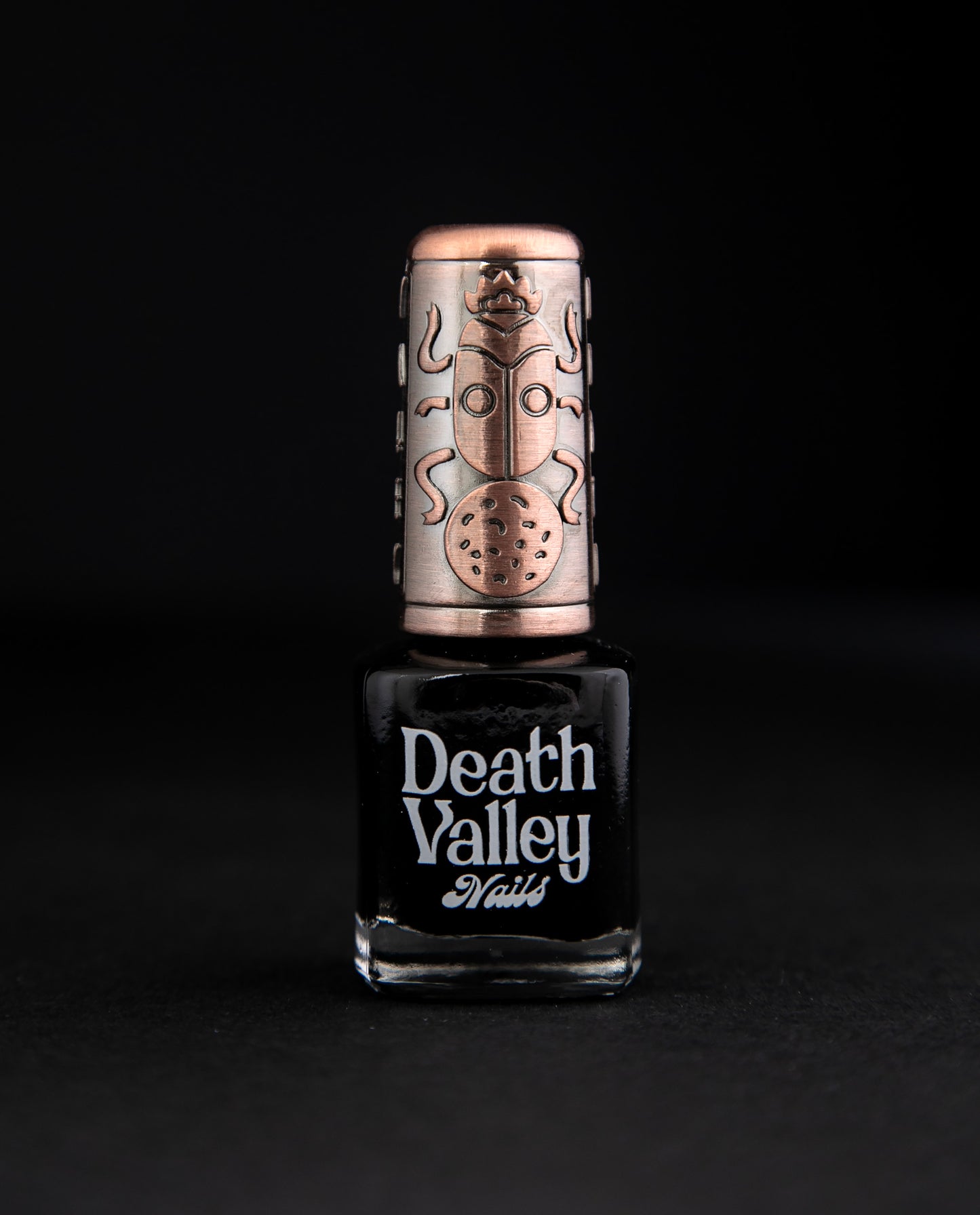 "Badwater" nail polish on black background. The polish is a matte black colour.