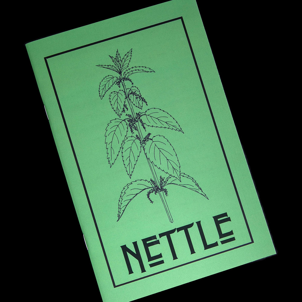 
                      
                        Front view of Herbal Revolution's "Nettle" zine on black background. The cover is green with a botanical illustration of nettle, and the word "NETTLE" written in large black letters on the front.
                      
                    