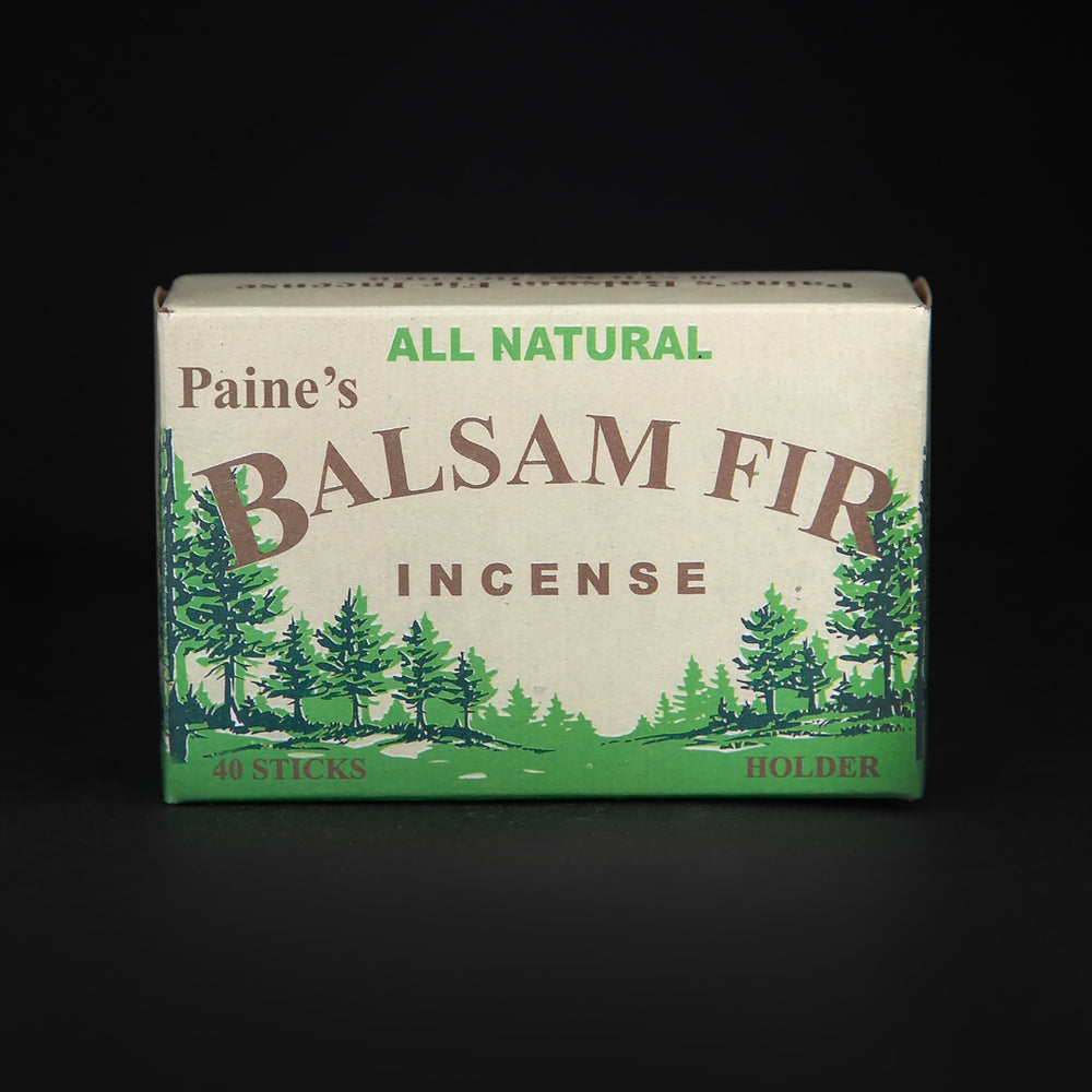 
                      
                        Closed box of Paine's Balsam Fir incense on black background. The box is tan, brown, and green, with illustrations of balsam fir trees on it
                      
                    