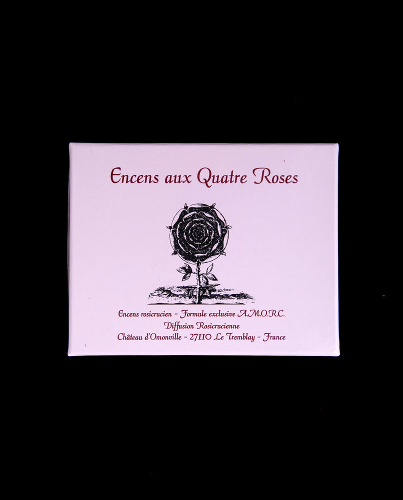 Pink box containing "Quatre Roses" Rosicrucian incense, displayed against a black background