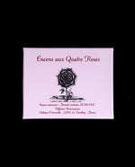 Pink box containing "Quatre Roses" Rosicrucian incense, displayed against a black background