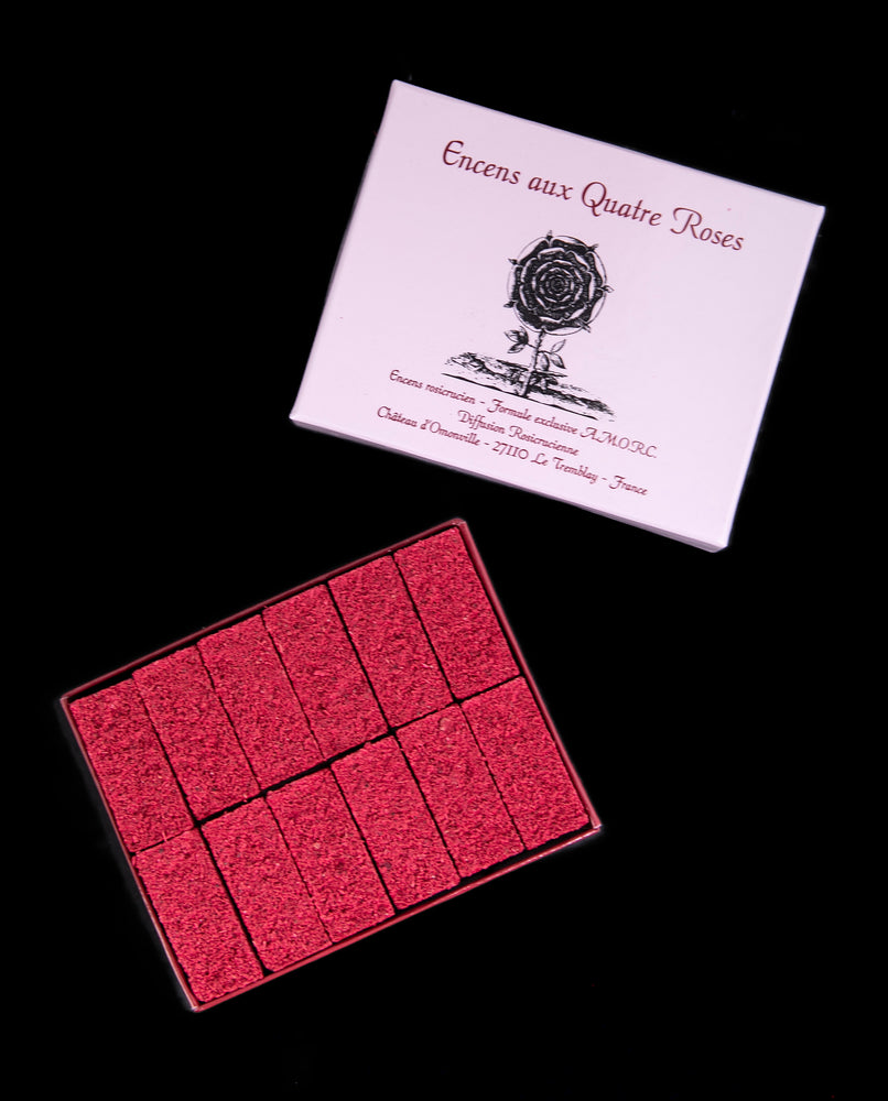 Open box revealing 12 tighly packed bricks of "Quatre Roses"  incense