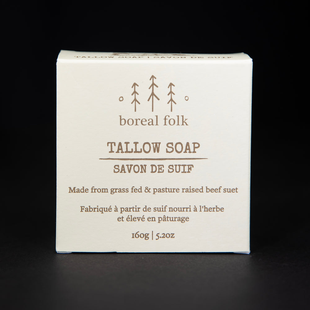 Cream coloured cardboard box of Boreal Folk's tallow soap against a black background