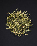 small pile of "yuzu bouquet" tea viewed from above against a black background