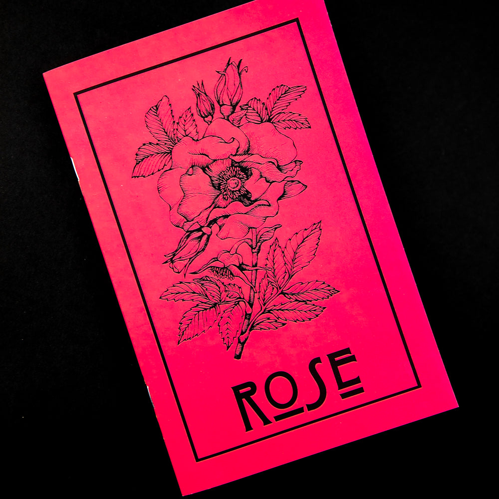 Herbal Revolution's zine about roses on black background. The cover is red, reads "Rose" in bold lettering, and features a simple illustration of a rose and stem.