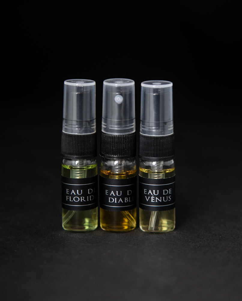 Full sample set of LVNEA's Eau de Cologne collection on black background. Includes Eau de Floride, Eau du Diable and Eau de Venus, each in a 3ml glass spray top bottle. 