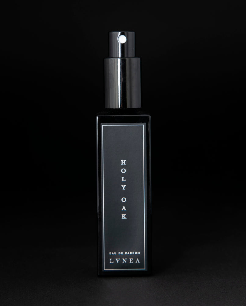 Black box that LVNEA's Holy Oak natural perfume is packaged in on black background