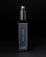 Black box that LVNEA's Holy Oak natural perfume is packaged in on black background