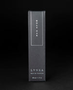 Black box that LVNEA's Holy Oak natural perfume is packaged in on black background