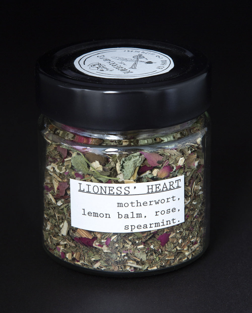 Clear glass jar filled with a herbal tea blend by blueberryjams.