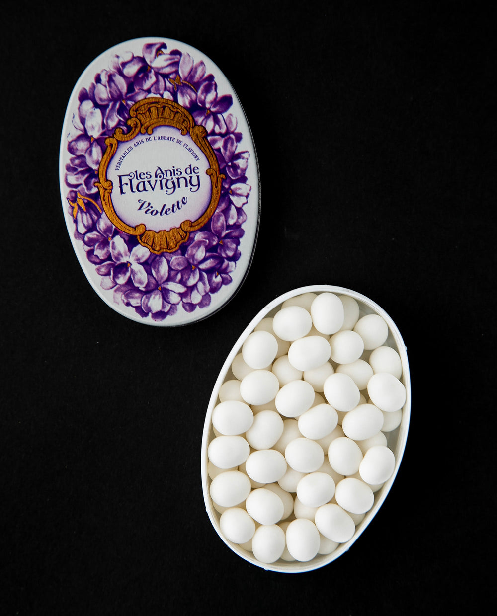 White and purple metal tin of Anis de Flavigny bonbons. 